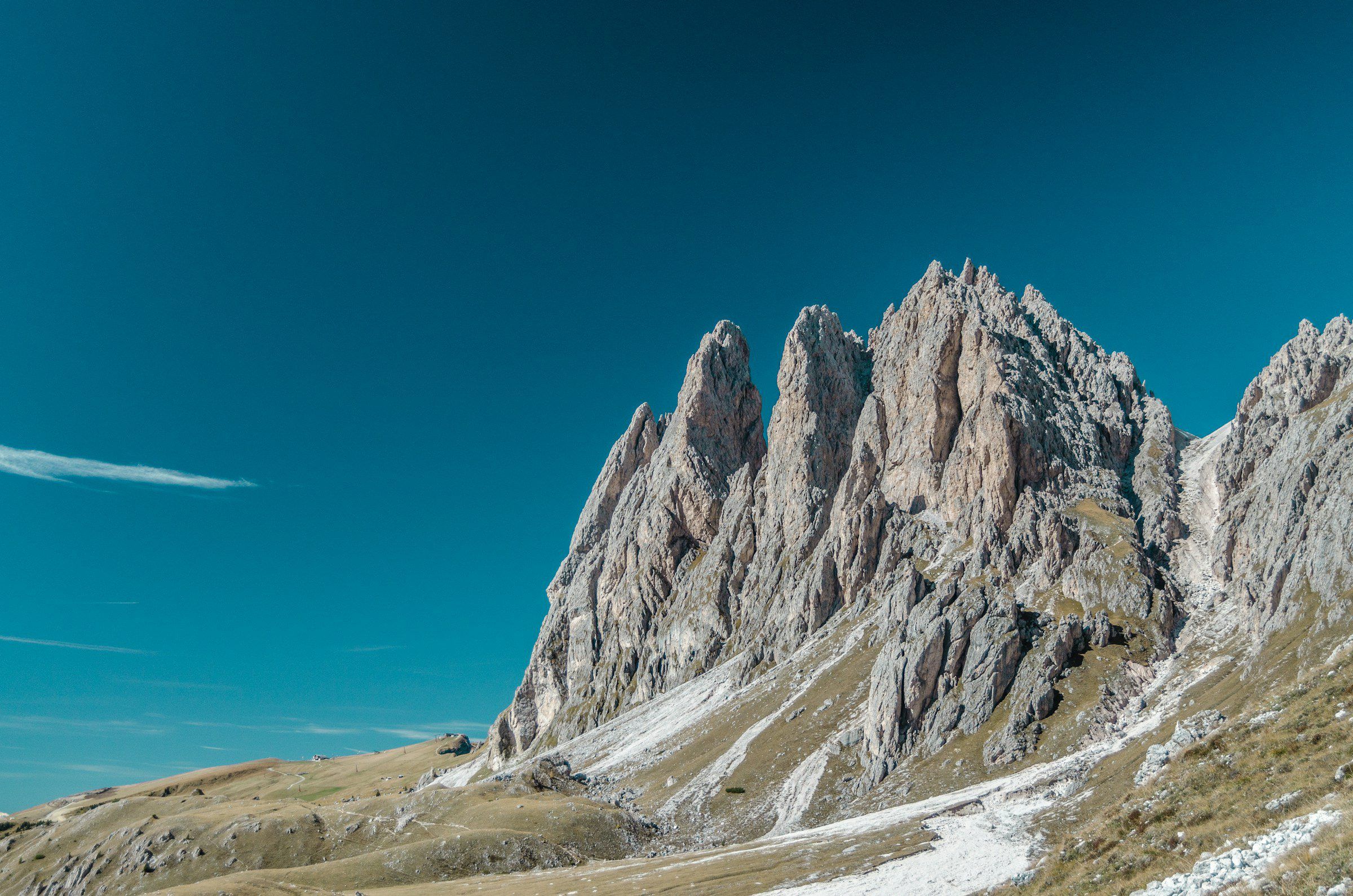 The jagged Seceda ridge in the Dolomites against a deep blue sky