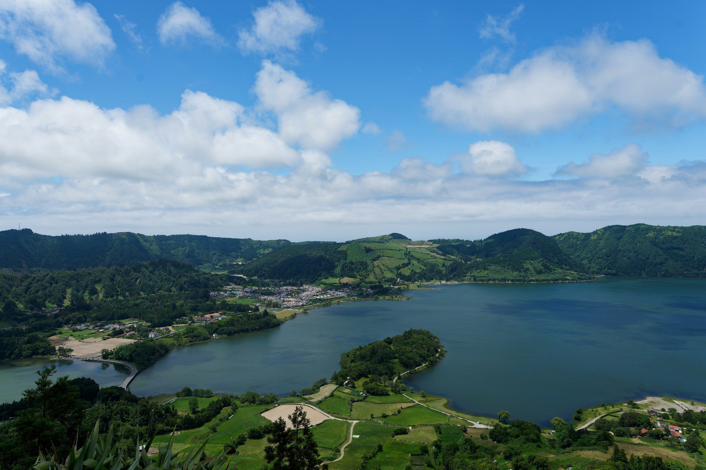 The Sete Cidades crater lake on São Miguel in the Azores under a blue sky